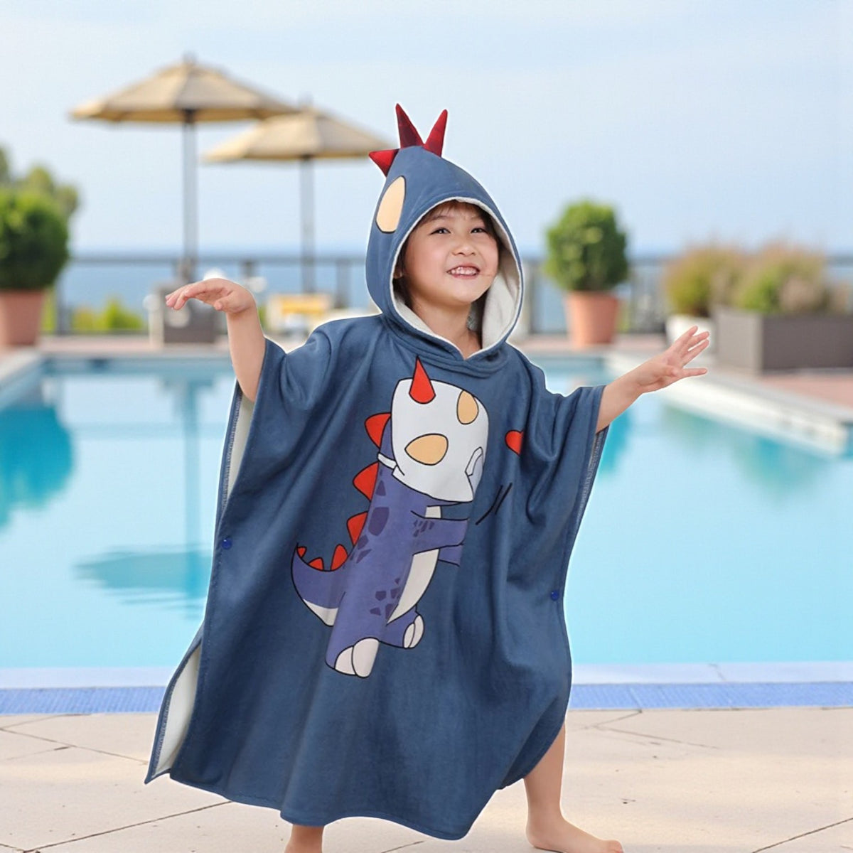 Poncho plage enfant avec capuche dinosaure